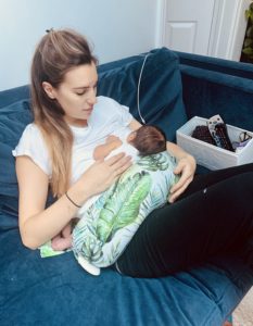 Breastfeeding with a nursing pillow and breastfeeding box